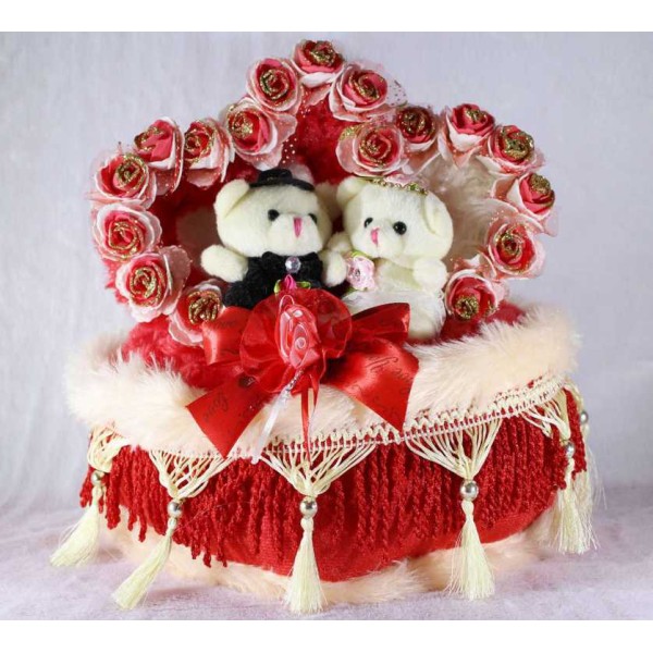 Beautiful Love Couple Teddy Bears Sitting on a Decorated Heart Cushion